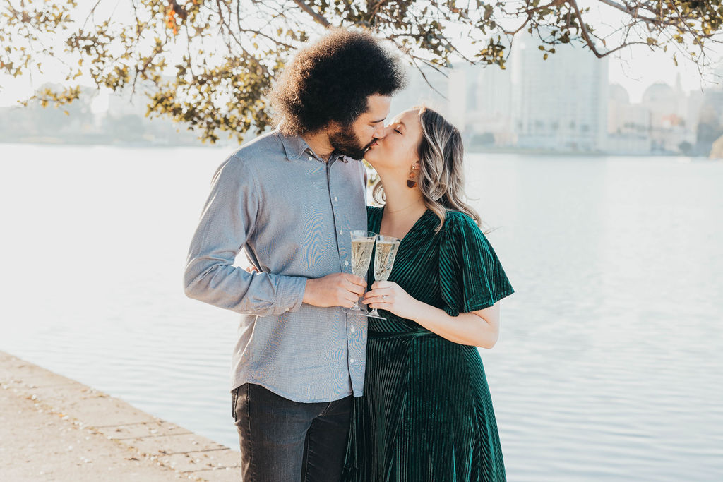 Couple posing for engagement photos in Oakland CA Merritt Lake