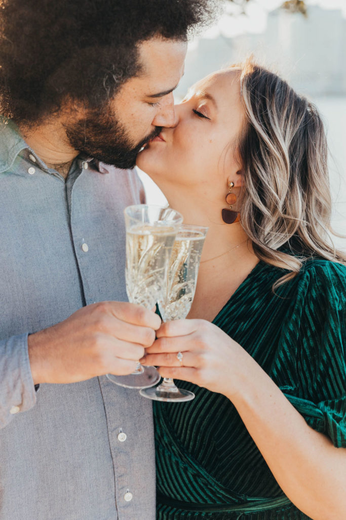 Couple posing for photos with champagne