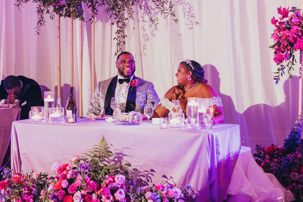 Bride and groom at reception table