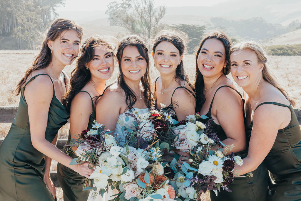 Bride and bridesmaids after wedding ceremony in California 