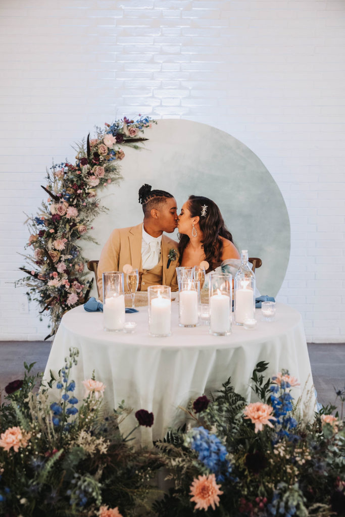 Couple at their reception table during wedding in CA