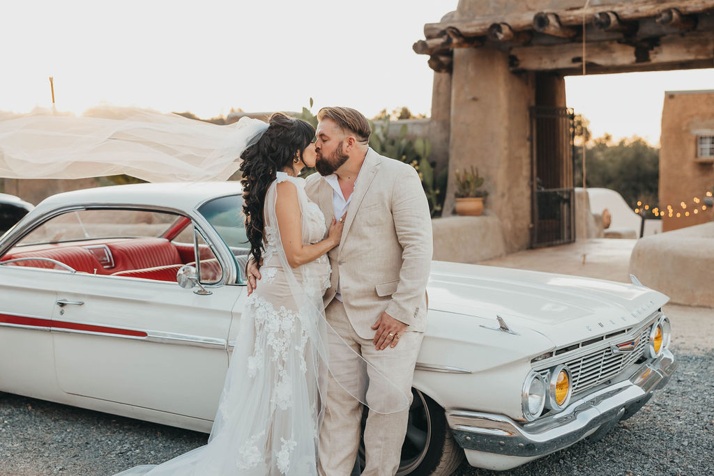 Bride and groom portraits with vintage car for small wedding in California - 