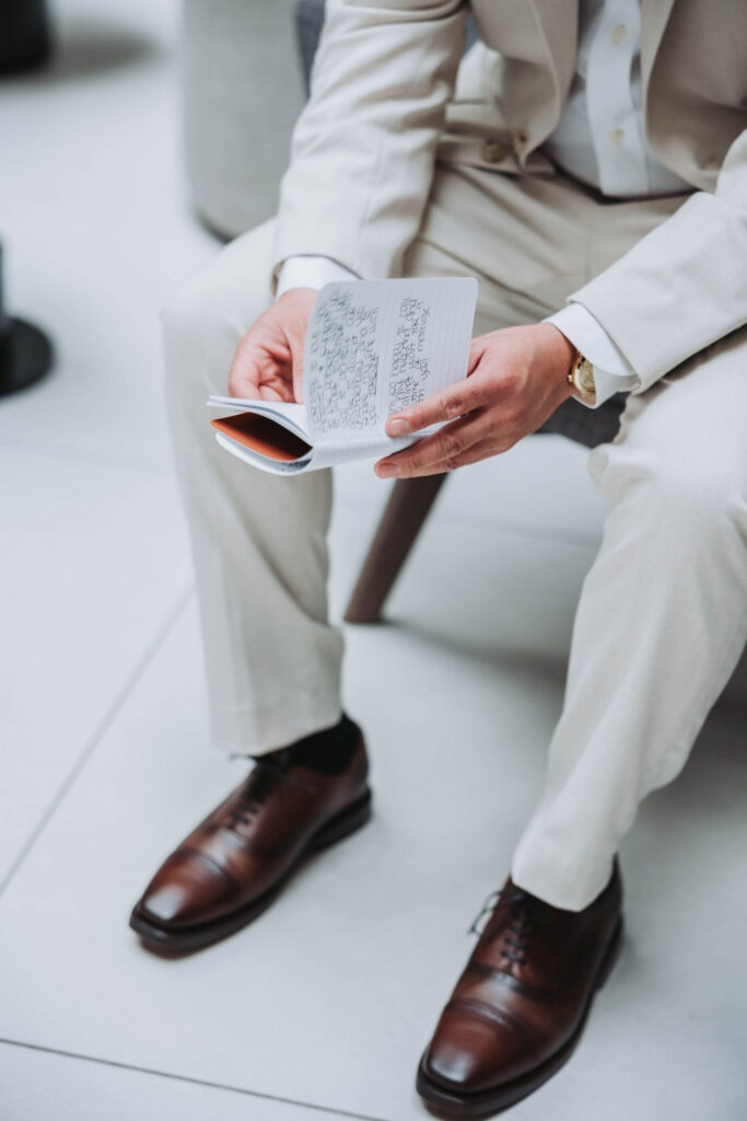 Groom reading notes before ceremony