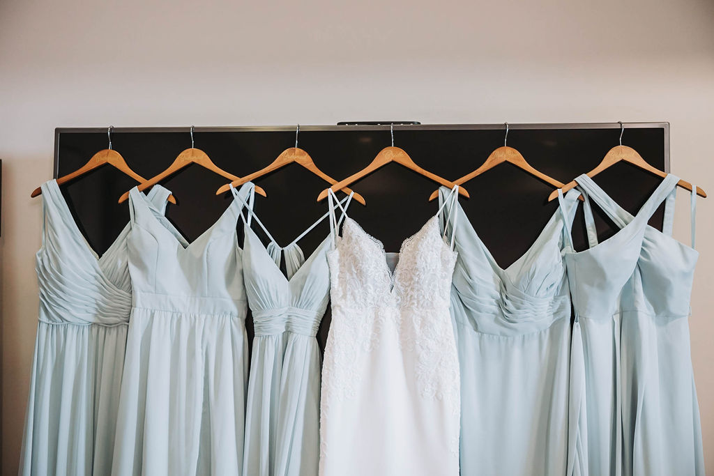 Brides wedding dress and blue bridesmaids dresses