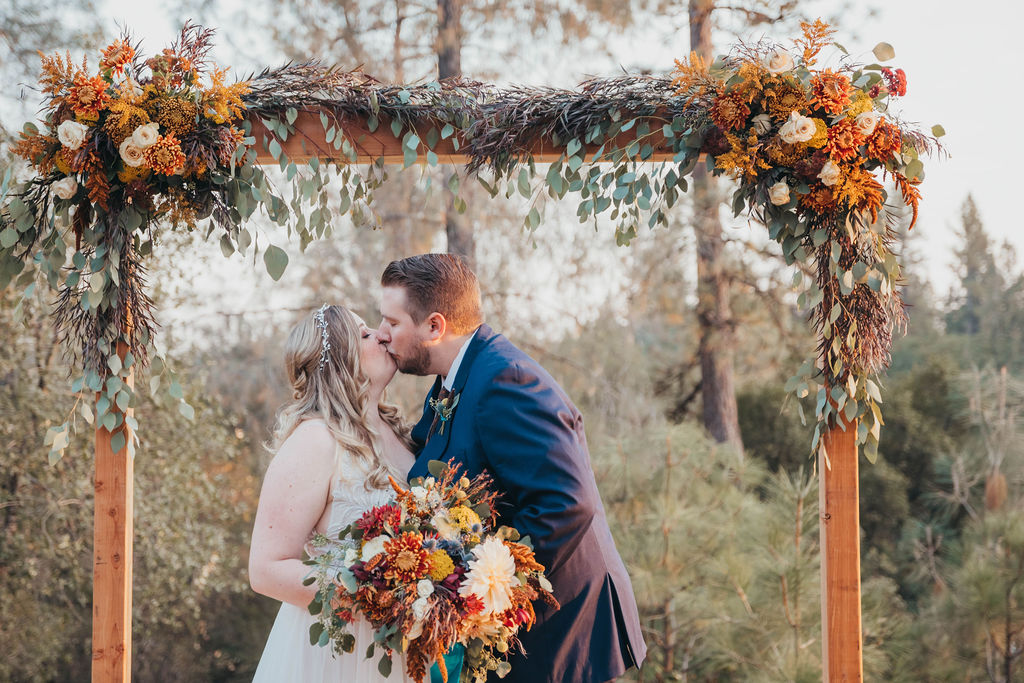 Bride and groom portraits from a rusitc fall wedding in California El Dorado County