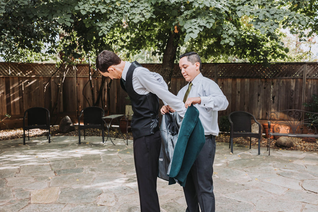 Groom and groomsmen getting ready for wedding ceremony