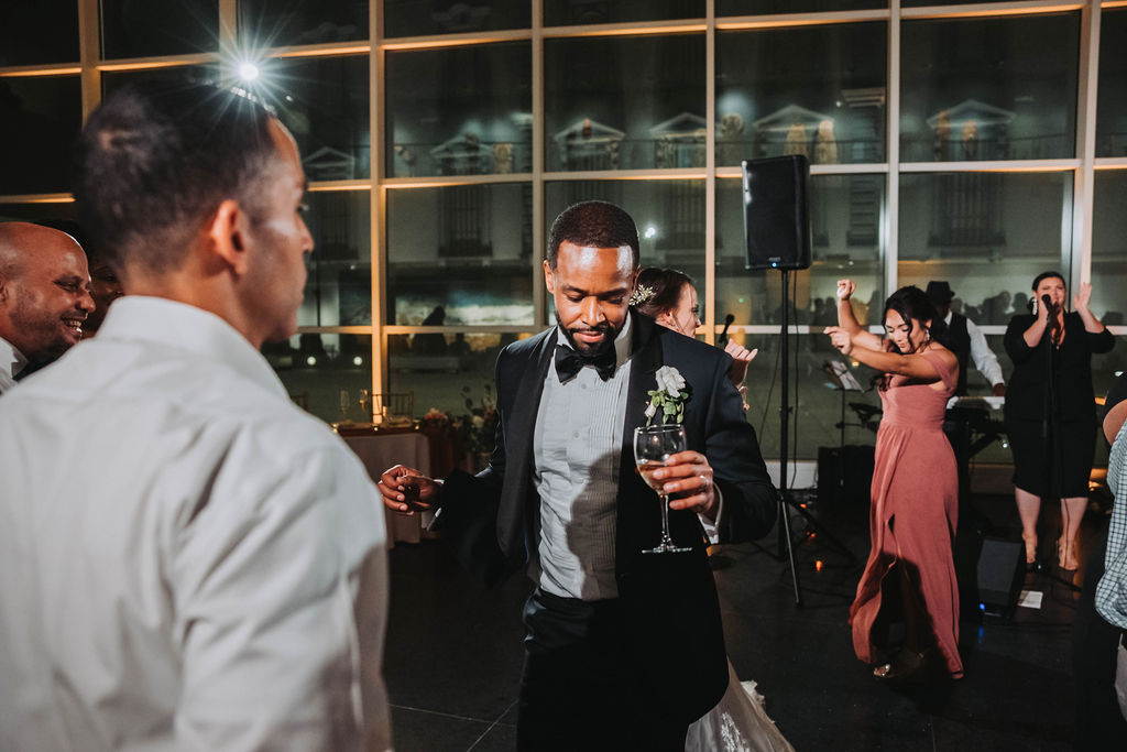 Groom dancing during wedding reception