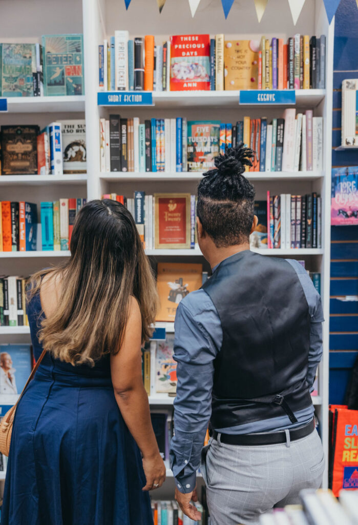 Couples engagement session in a book store