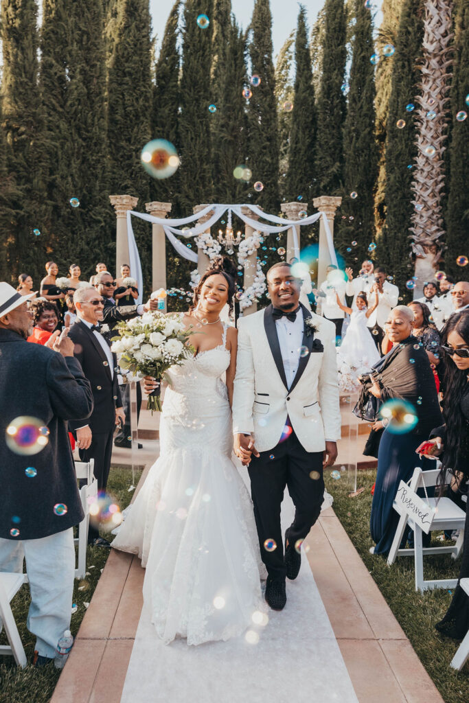 Bride and grooms bubble wedding exit 