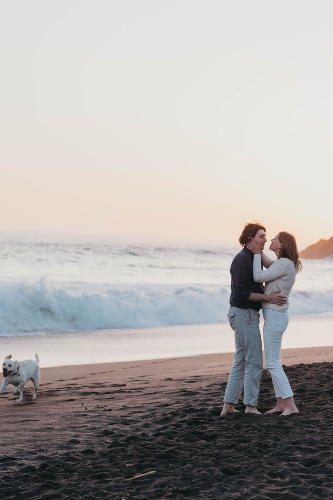 Couples beach engagement photo session at Rodeo Beach Coastal Trailhead