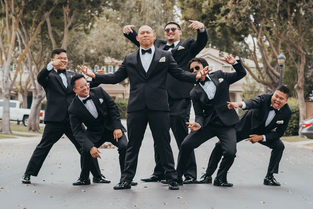Groom and groomsmen portraits from winter wedding at Woodbridge Golf and Country Club