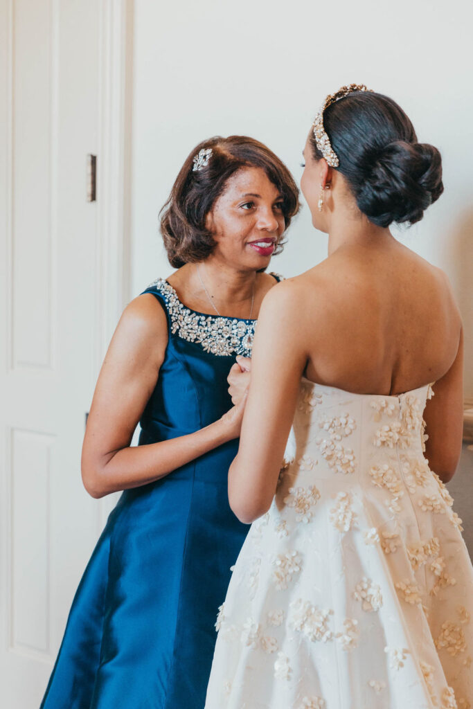 Bride getting ready with her mother before wedding