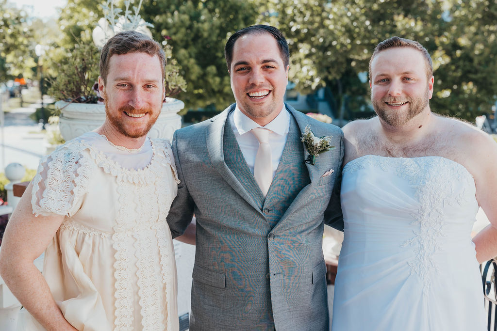Groom with groomsmen in dresses