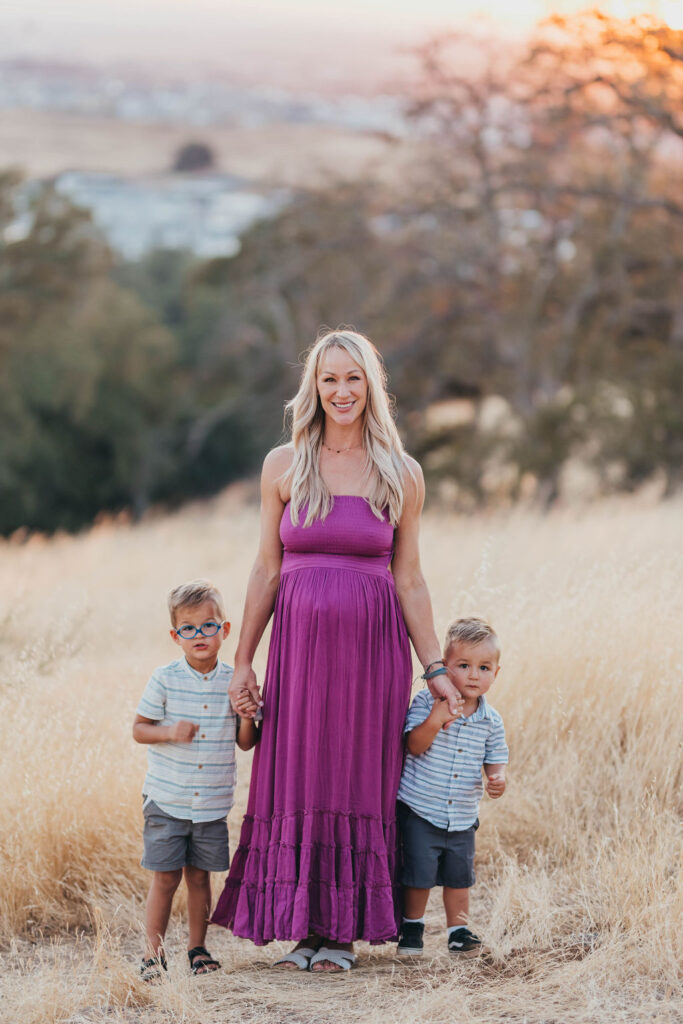 Pregnant mother and her two children posing for photos