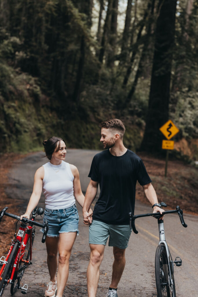 Couple Biking For Adventurous Woodsy Engagement Photos in Northern California
