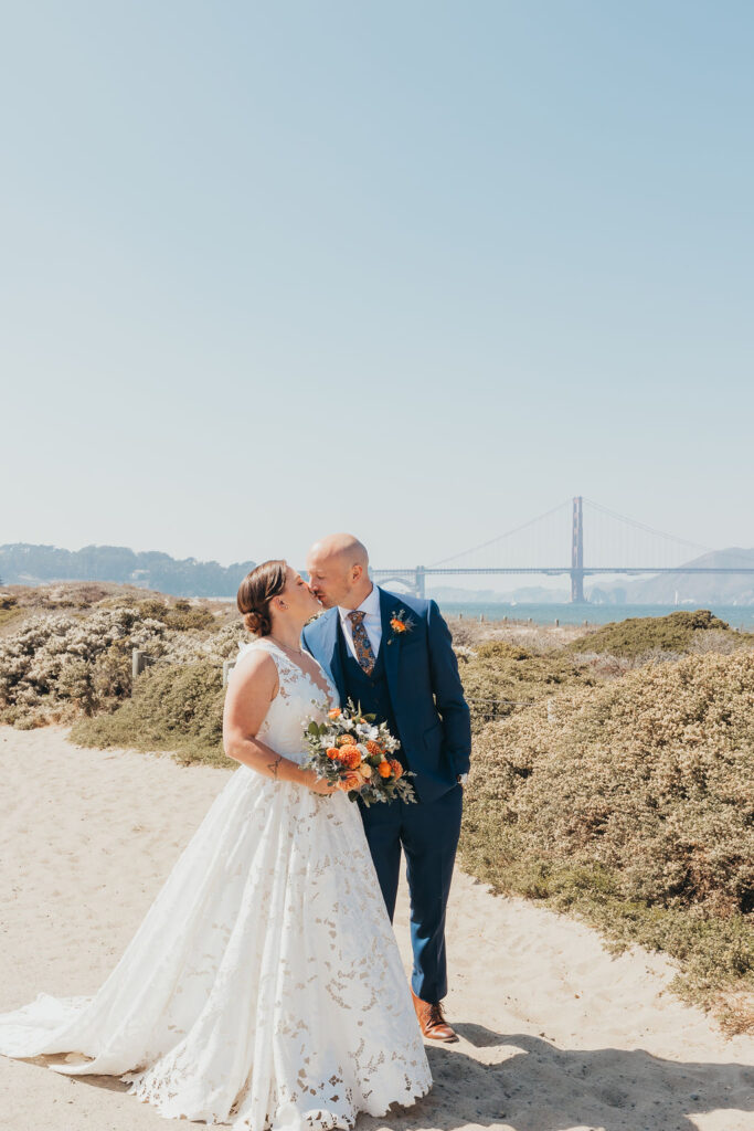 Bride and groom portraits at Crissy field for their destination California beach wedding