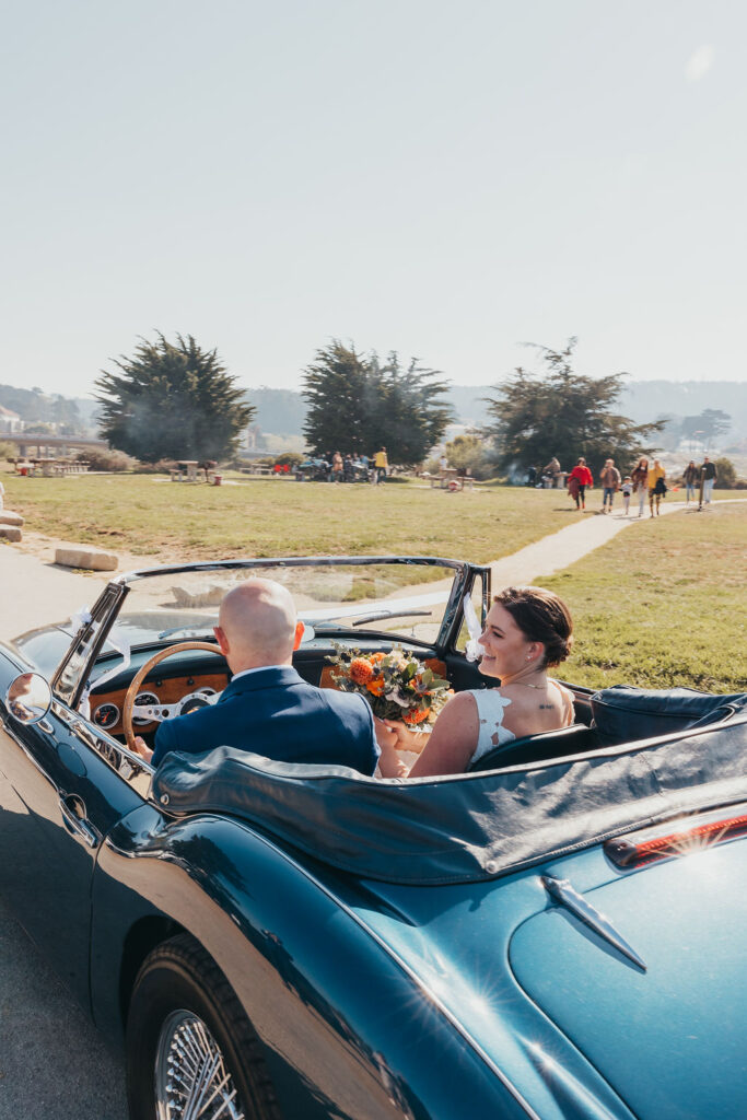 Bride and groom portraits with a vintage blue car