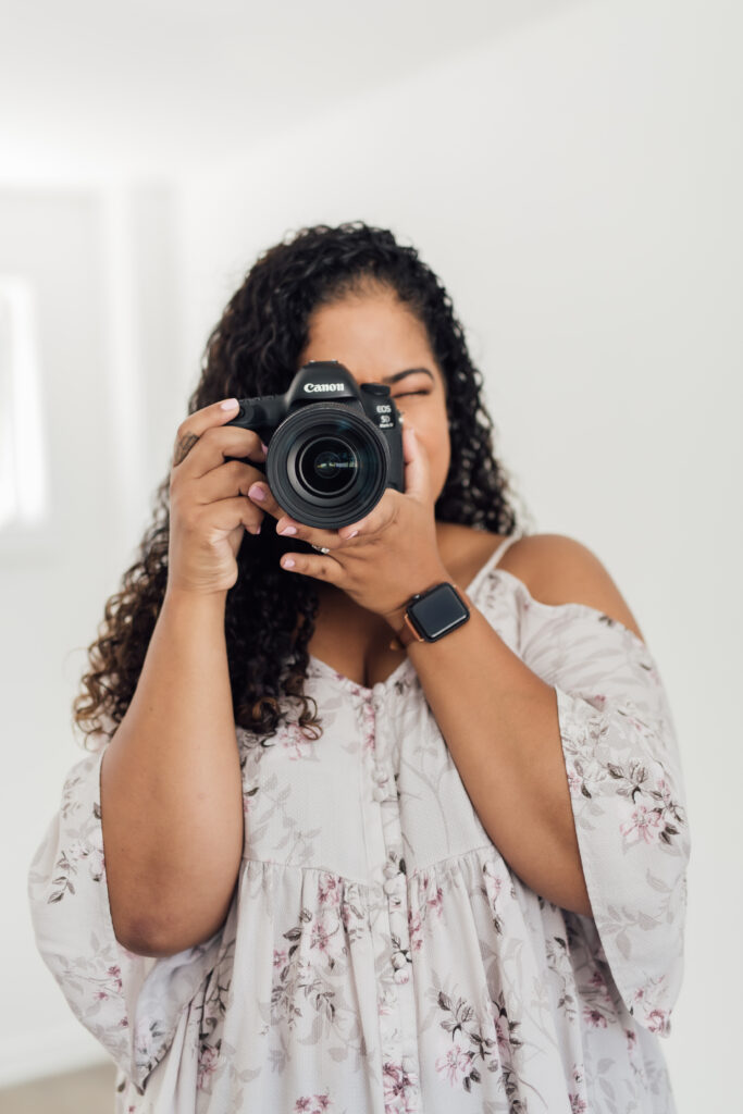 Woman holding her camera