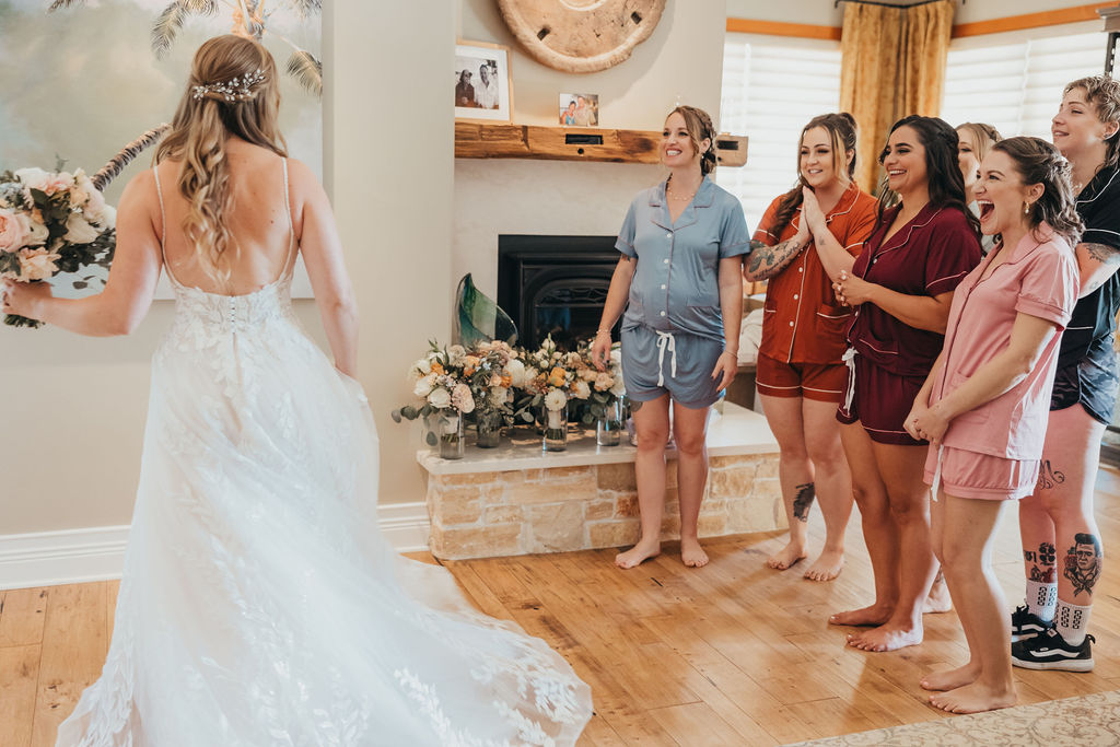 Brides first look with bridesmaids
