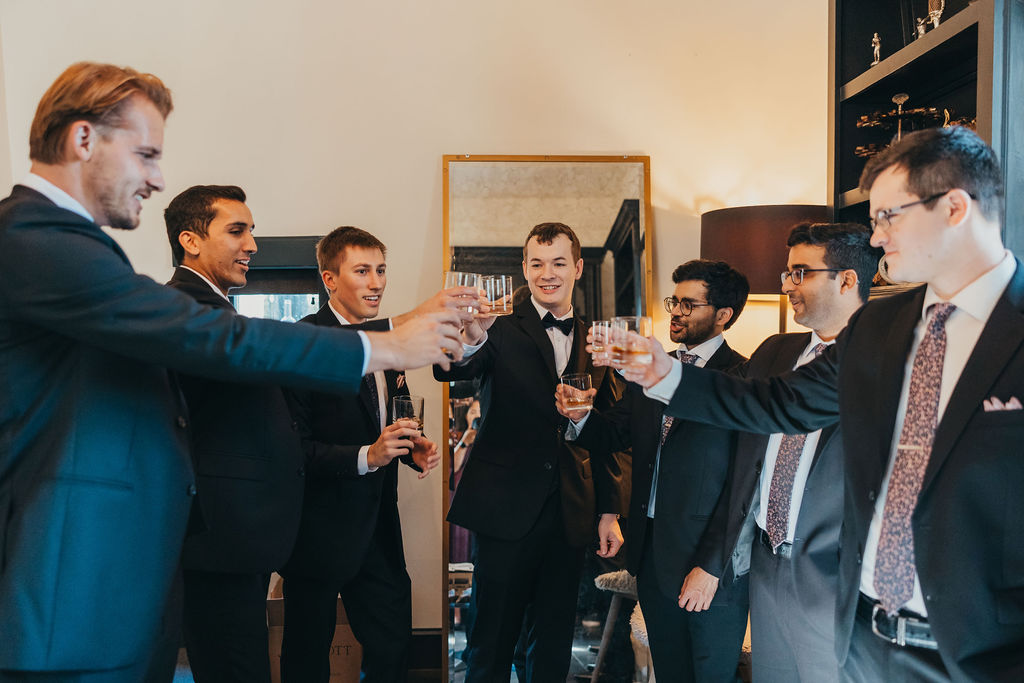Groom and groomsmen toasting