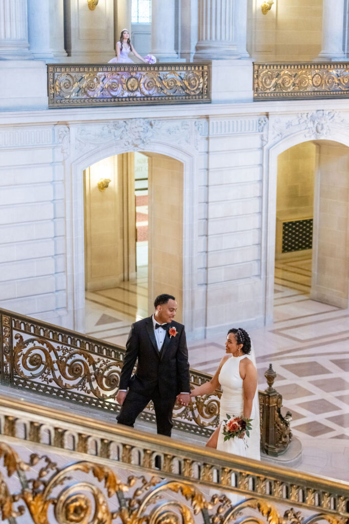 Couple posing for elopement photos at SF City hall