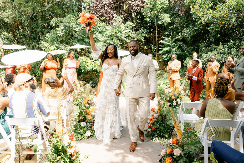 a couple posing for their vibrant wedding photos