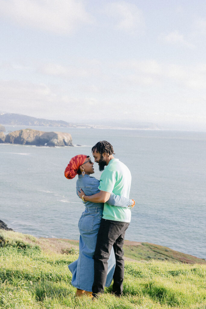 a couple posing for a coastal couples session