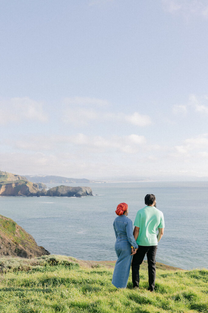 a couple posing for a coastal couples session