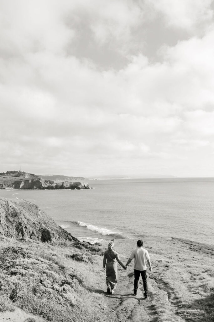 a couple posing for a coastal couples session