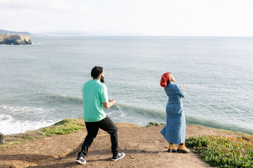 a couple posing for a coastal couples session