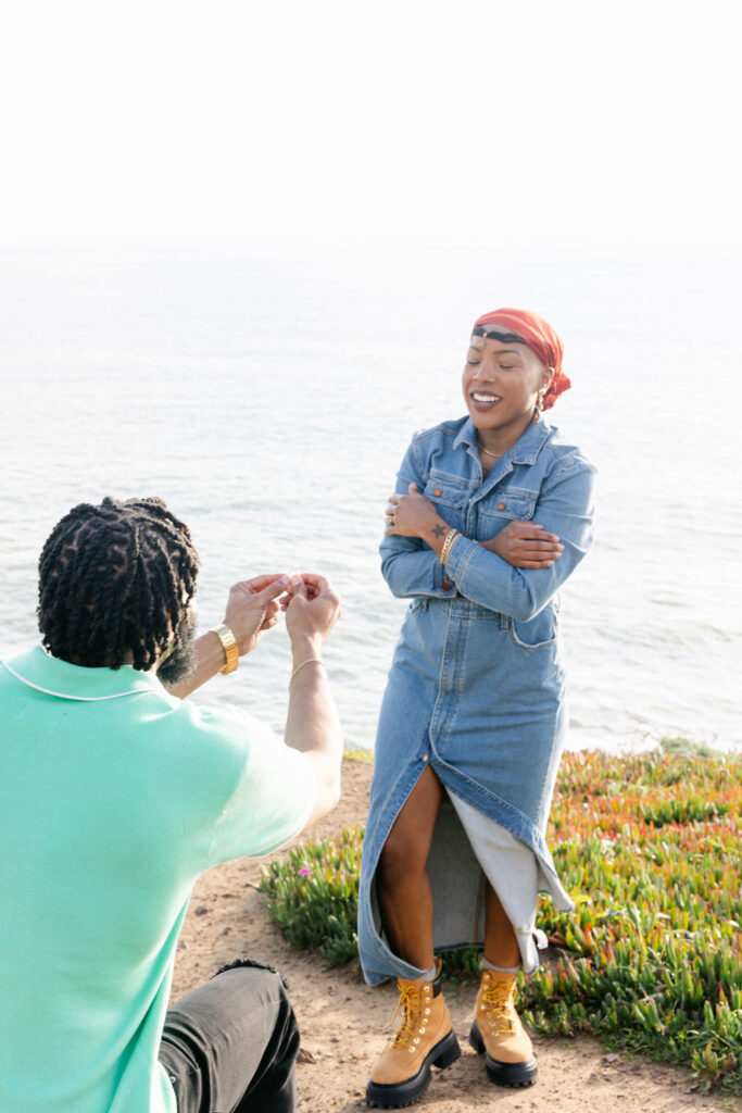 a couple posing for a coastal couples session