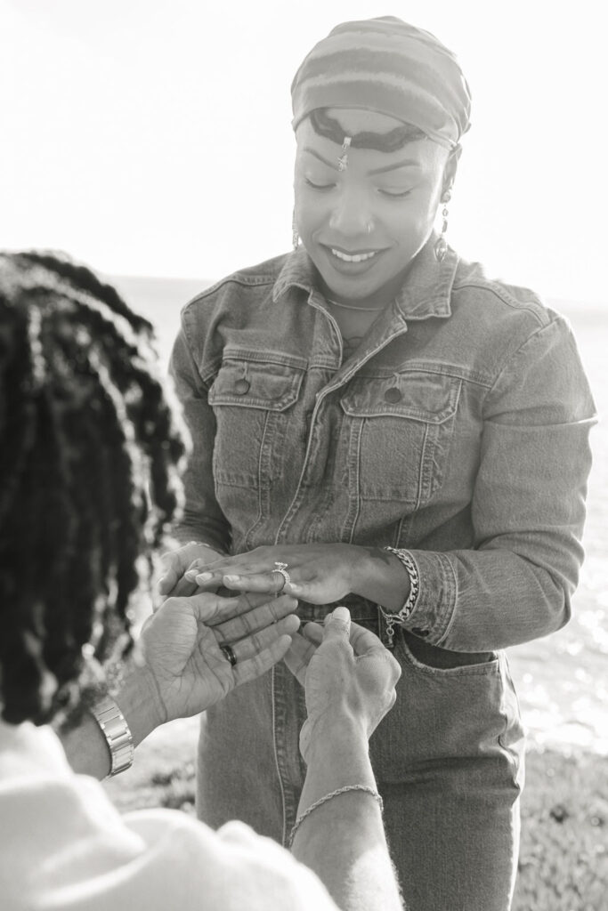 a couple posing and laughing during their seaside couples session