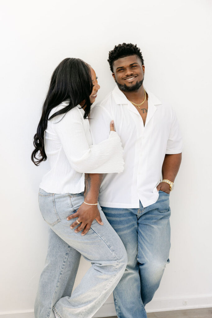 Sweet forehead kiss during an intimate engagement photo shoot | engagement session posing
