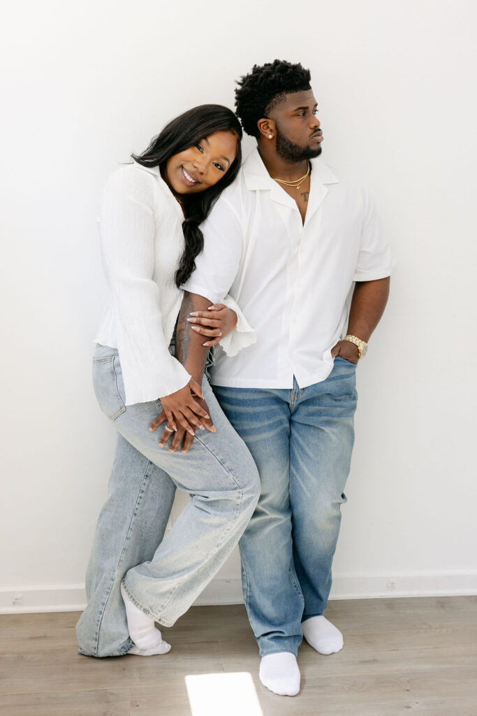 Sweet forehead kiss during an intimate engagement photo shoot | engagement session posing
