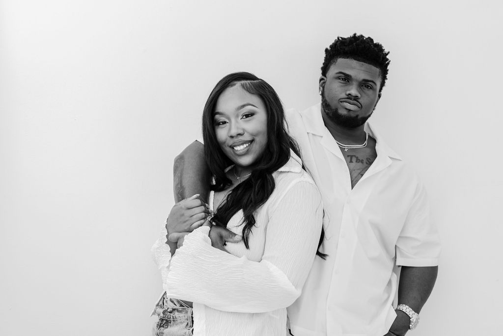 Sweet forehead kiss during an intimate engagement photo shoot | engagement session posing
