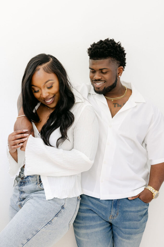 Sweet forehead kiss during an intimate engagement photo shoot | engagement session posing
