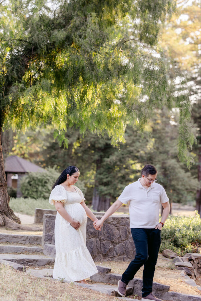 Candid maternity photography showing parents celebrating pregnancy
